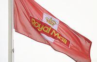 FILE PHOTO: A Royal Mail flag flies near a sorting office as workers strike, in west London, Britain, November 24, 2022. REUTERS/Toby Melville/File Photo