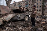 Local resident Serhii stands next to his car destroyed by a Russian missile strike, amid Russia's attack on Ukraine, in Kostiantynivka, Donetsk region, Ukraine January 28, 2023. REUTERS/Oleksandr Ratushniak     TPX IMAGES OF THE DAY