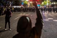 Protesters and police face off in Portland, Ore., on Sept. 26, 2020.