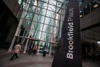 People walk to Brookfield Place off Bay Street on the day of the annual general meeting for Brookfield Asset Management shareholders in Toronto, May 7, 2014. REUTERS/Mark Blinch/Files