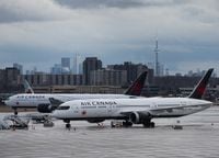 Air Canada airplanes sit on the tarmac at Pearson International Airport in Toronto on Friday, March 20, 2020. THE CANADIAN PRESS/Nathan Denette