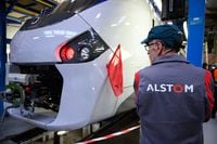 An employee observes a train during the renovation presentation of the Ile-de-France's RER B trains at the Alstom factory in Reichshoffen, eastern France on Oct. 4, 2019.