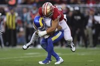 San Francisco 49ers defensive end Nick Bosa, top, sacks Los Angeles Rams quarterback Matthew Stafford during the first half of an NFL football game in Santa Clara, Calif., Monday, Oct. 3, 2022. (AP Photo/Jed Jacobsohn)