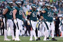 PHILADELPHIA, PENNSYLVANIA - JANUARY 01: Philadelphia Eagles offensive line reacts against the New Orleans Saints during the fourth quarter at Lincoln Financial Field on January 01, 2023 in Philadelphia, Pennsylvania. (Photo by Tim Nwachukwu/Getty Images)