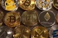 FILE PHOTO: Representations of cryptocurrencies are seen in this illustration, August 10, 2022. REUTERS/Dado Ruvic/Illustration