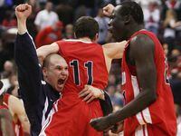 Acadia University Axemen's Peter Leighton, middle, gets picked up by assistant coach Steve Baur as they celebrate their defeated over the five-time champion Carleton University Ravens 82-80 in double over-time of the second semifinal of the 2008 CIS "Final 8" Men's Basketball National Championship in Ottawa on Saturday March 15, 2008. THE CANADIAN PRESS/Sean Kilpatrick