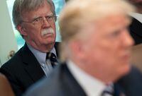 In this file photo U.S. President Donald Trump speaks alongside National Security Adviser John Bolton (L) during a cabinet meeting in the Cabinet Room of the White House in Washington on May 9, 2018.