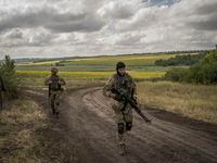 FILE — Ukrainian soldiers during a military training by the Mozart Group in rural Donbas, eastern Ukraine, on July 23, 2022. The Mozart Group, one of the most prominent American military companies operating in Ukraine, was performing important work for a while; then the money ran out and things turned unpleasant. (Laura Boushnak/The New York Times)