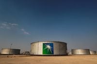FILE PHOTO: A view shows branded oil tanks at Saudi Aramco oil facility in Abqaiq, Saudi Arabia October 12, 2019. REUTERS/Maxim Shemetov//File Photo