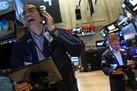 Traders work on the floor of the New York Stock Exchange (NYSE) on Sept. 26.