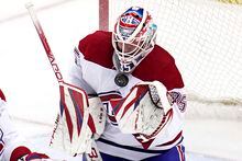 Montreal Canadiens goaltender Sam Montembeault blocks a shot during the third period of the team's NHL hockey game against the Pittsburgh Penguins in Pittsburgh, Tuesday, March 14, 2023. (AP Photo/Gene J. Puskar)