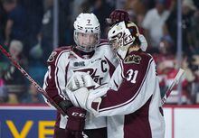Peterborough Petes' Shawn Spearing, left, and goalie Michael Simpson celebrate after Peterborough defeated the Quebec Remparts 4-2 during Memorial Cup hockey action, in Kamloops, B.C., on Tuesday, May 30, 2023. THE CANADIAN PRESS/Darryl Dyck