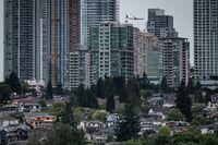 An Air Canada Boeing 787 aircraft arriving from Toronto passes behind condo towers in the Metrotown area of Burnaby, B.C., while on approach to land at Vancouver International Airport, on Sunday, May 30, 2021. THE CANADIAN PRESS/Darryl Dyck