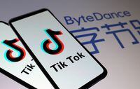 Tik Tok logos are seen on smartphones in front of a displayed ByteDance logo in this illustration taken on Nov. 27, 2019.