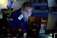 Trader John Romolo works on the floor of the New York Stock Exchange, Thursday, Sept. 9.