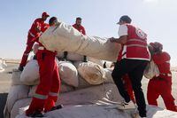 Egyptian Red Crescent members coordinate aid for Gaza, after United Nations Secretary-General Antonio Guterres visited the Rafah border crossing between Egypt and the Gaza Strip, at Al Arish Airport, Egypt, October 20, 2023. REUTERS/Amr Abdallah Dalsh