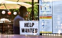 A 'Help Wanted' sign is posted on the window of a restaurant in Los Angeles, Calif., on May 28, 2021.