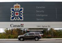 FILE PHOTO: A vehicle passes a sign outside the Canadian Security Intelligence Service (CSIS) headquarters in Ottawa, November 5, 2014. REUTERS/Chris Wattie/File Photo