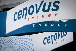 Athabasca Oil Corp. and Cenovus Energy Inc. have closed a previously announced deal creating a new joint venture stand-alone company called Duvernay Energy Corp. Cenovus Energy logos are on display at the Global Energy Show in Calgary, Alta., Tuesday, June 7, 2022. THE CANADIAN PRESS/Jeff McIntosh