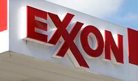 FILE - An Exxon service station sign is seen, on April 25, 2017, in Nashville, Tenn. Exxon Mobil is buying Pioneer Natural Resources in an all-stock deal valued at $59.5 billion, its largest buyout since acquiring Mobil two decades ago, creating a colossal fracking operator in West Texas. (AP Photo/Mark Humphrey, File)