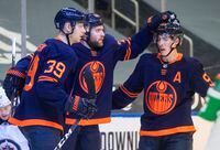 Edmonton Oilers' Alex Chiasson (39), Leon Draisaitl (29) and Ryan Nugent-Hopkins (93) celebrate a goal against the Winnipeg Jets during second period NHL action in Edmonton on Wednesday, February 17, 2021. THE CANADIAN PRESS/Jason Franson