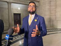 Obby Khan speaks to reporters after being sworn-in as a member of the Manitoba legislature in Winnipeg, Monday, April 4, 2022. A Manitoba cabinet minister is accusing Opposition NDP Leader Wab Kinew of swearing at him and shoving him. THE CANADIAN PRESS/Steve Lambert
