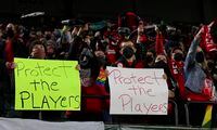 FILE - Portland Thorns fans hold signs during the first half of the team's National Women's Soccer League soccer match against the Houston Dash in Portland, Ore., Oct. 6, 2021. An investigation commissioned by the NWSL and its players union found “widespread misconduct" directed at players dating back to the beginnings nearly a decade ago of the country's top women's professional league. (AP Photo/Steve Dipaola, File)
