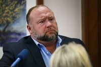 FILE PHOTO: Alex Jones attempts to answer questions about his emails asked by Mark Bankston, lawyer for Neil Heslin and Scarlett Lewis, during trial at the Travis County Courthouse, Austin, Texas, U.S., August 3, 2022.  Briana Sanchez/Pool via REUTERS/File Photo