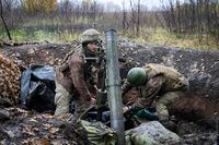 Ukrainian soldiers target their mortar in the front line position near Bakhmut the site of the heaviest battle against the Russian troops in the Donetsk region, Ukraine, Thursday, Oct. 27, 2022. (AP Photo/Efrem Lukatsky)