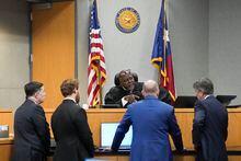 Judge Clifford Brown speaks with the defense and prosecution during Daniel Perry's sentencing hearing in the 147th District Courtroom at the Travis County Justice Center, Tuesday, May 9, 2023, in Austin, Texas. Perry, a U.S. Army sergeant convicted of murder in the fatal shooting of Air Force veteran Garrett Foster, 28, an armed protester during a Black Lives Matter demonstration in Texas, could be facing up to life in prison. (Mikala Compton/Austin American-Statesman via AP)