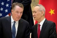 FILE PHOTO: U.S. Trade Representative Robert Lighthizer, left, listens as Chinese Vice Premier Liu He talks while they line up for a group photo at the Diaoyutai State Guesthouse in Beijing, China February 15, 2019. Mark Schiefelbein/Pool via REUTERS
