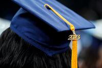 For Canada's post-secondary graduates, the academic stress of school is often replaced by a whole new headache: years’ worth of student loans.  A tassel with 2023 on it rests on a graduation cap as students walk in a procession for Howard University's commencement in Washington, Saturday, May 13, 2023. THE CANADIAN PRESS/AP/Alex Brandon