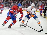 Dec 16, 2023; Montreal, Quebec, CAN; New York Islanders forward Brock Nelson (29) slashes the stick out of the hands of Montreal Canadiens forward Josh Anderson (17) during the second period at the Bell Centre. Mandatory Credit: Eric Bolte-USA TODAY Sports
