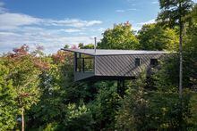 Rural home of architect Paul Kariouk. Cantilevered off a steep cliff side, 60 feet above the ground is the m.o.r.e. Cabin. Designed by Kariouk as a weekend escape, the cabin lies just an hour outside of Ottawa in the rural municipality of La Pêche, Quebec.