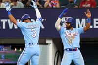 Texas Rangers' Leody Taveras (3) celebrates with Ezequiel Duran, right, after hitting a two-run home run in the seventh inning against the Toronto Blue Jays in a baseball game Sunday, June 18, 2023, in Arlington, Texas. (AP Photo/Richard W. Rodriguez)