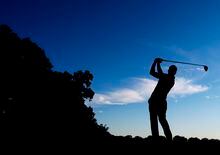 A golfer is silhouetted in Oakville, Ont., on Friday, July 26, 2013. The PGA Tour is merging two of its third-tier circuits.PGA Tour Canada and PGA Tour Latinoamérica will combine to become the PGA Tour Americas in February. THE CANADIAN PRESS/Nathan Denette