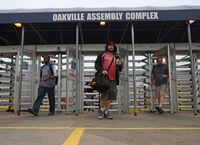 Ford workers at the Oakville Assembly plant leave work on Sept. 8, 2020, in Oakville, Ont.