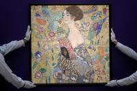 FILE - Gustav Klimt's 'Dame mit Faecher' (Lady with a Fan) is displayed at Sotheby's auction rooms in London, Tuesday, June 20, 2023. A late-life masterpiece by Austrian artist Gustav Klimt has sold for 74 million pounds ($94.35 million), making it the most expensive painting ever auctioned in Europe. “Dame mit Fächer” — Lady with a Fan — sold to a buyer in the room at Sotheby’s in London on Tuesday, June 27, 2023. The sale price exceeded the pre-sale estimate of 65 million pounds, or $80 million. (AP Photo/Kirsty Wigglesworth, File)