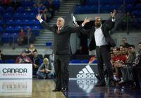 McGill Redmen head coach David DeAveiro, left, and assistant coach Juan Mendez react to a foul called against the Redmen during quarter-final CIS men's national university basketball championship action against the University of Calgary Dinos in Vancouver on Thursday, March 17, 2016. DeAveiro has been named head coach of the Ryerson Rams men's basketball team. THE CANADIAN PRESS/Darryl Dyck