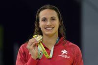 Kylie Masse of Canada poses after winning the gold medal in the Women's 50 meters backstroke final during the swimming competition of the Commonwealth Games, at the Sandwell Aquatics Centre in Birmingham, England, Wednesday, Aug. 3, 2022. THE CANADIAN PRESS/AP-Kirsty Wigglesworth