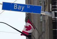 The Bay Street Financial District is shown with the Canadian flag in Toronto on Friday, Aug. 5.