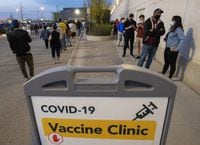 Hundreds of people line up for the Peel Region Doses After Dark vaccination clinic in Mississauga, Ont. on Saturday, May 15, 2021. THE CANADIAN PRESS/Frank Gunn