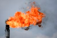 A flare stack burns off excess gas at a processing facility near Crossfield, Alta., Tuesday, June 13, 2023. Most Albertans would support some kind of national cap on carbon emissions from the oil and gas sector, two new polls suggest. THE CANADIAN PRESS/Jeff McIntosh
