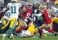 San Francisco 49ers' Dre Greenlaw returns an interception of a Green Bay Packers pass in the final minute of an NFL football NFC divisional playoff game Saturday, Jan. 20, 2024, in Santa Clara, Calif. (Scott Strazzante/San Francisco Chronicle via AP)