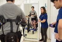 Physiotherapists help Ryan Straschnitzki perform standing exercises following his epidural implant surgery at World Health Hospital in Nonthaburi, Thailand on Friday, December 6, 2019. THE CANADIAN PRESS/Cory Wright