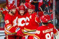 May 18, 2022; Calgary, Alberta, CAN; Calgary Flames center Blake Coleman (20) celebrates his goal with teammates against the Edmonton Oilers during the second period in game one of the second round of the 2022 Stanley Cup Playoffs at Scotiabank Saddledome. Mandatory Credit: Sergei Belski-USA TODAY Sports