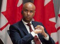 Families, Children and Social Development Minister Ahmed Hussen listens to a question during a news conference Tuesday April 21, 2020 in Ottawa. THE CANADIAN PRESS/Adrian Wyld