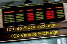FILE PHOTO: A sign board displaying Toronto Stock Exchange (TSX) stock information is seen in Toronto June 23, 2014.  REUTERS/Mark Blinch/File Photo