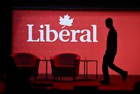 A stagehand works on the stage in between presenters at the 2023 Liberal National Convention in Ottawa on Thursday, May 4, 2023. THE CANADIAN PRESS/Justin Tang