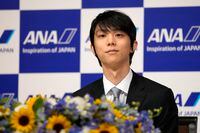 Two-time Olympic champion Yuzuru Hanyu of Japan, listens to a question during a press conference in Tokyo, Tuesday, July 19, 2022. Hanyu is stepping away from competitive figure skating, he said Tuesday. (AP Photo/Shuji Kajiyama)